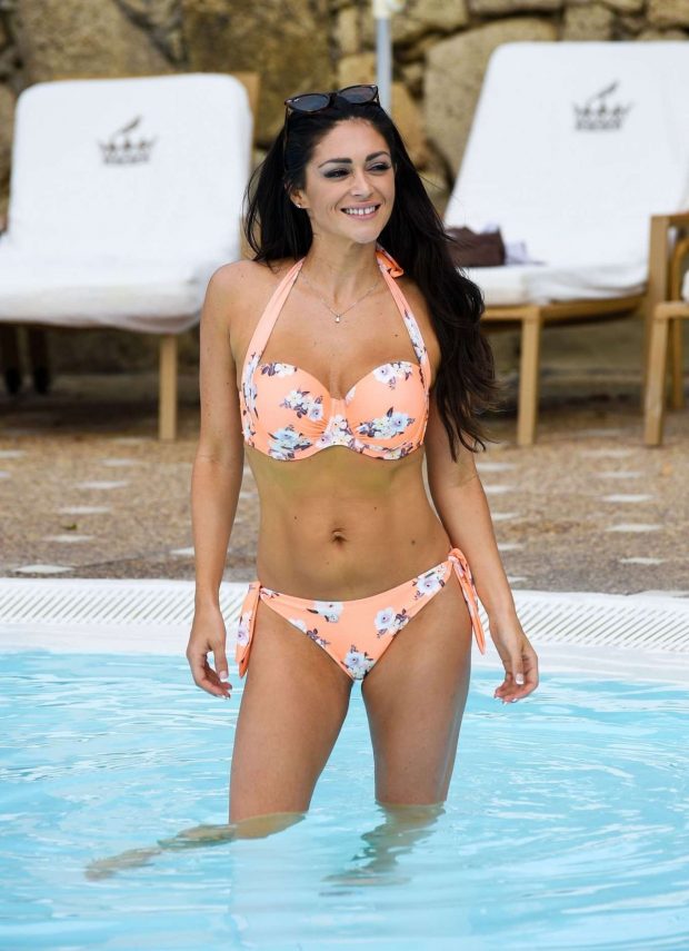 Casey Batchelor in Bikini on the pool in Tenerife