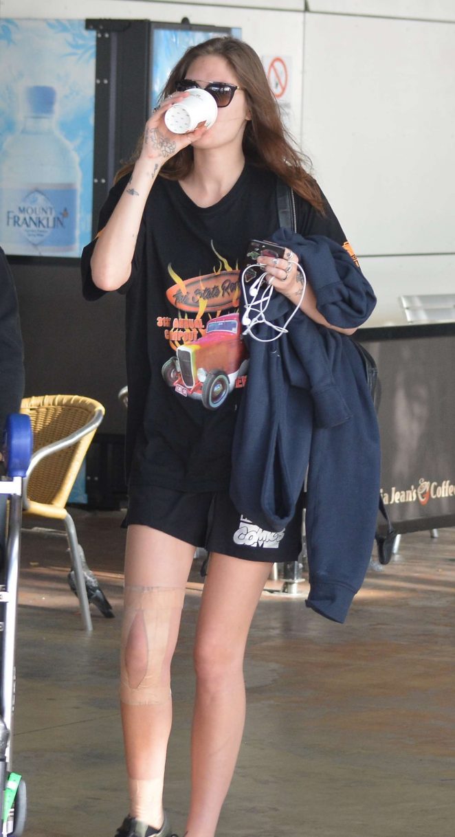 Catherine McNeil in Shorts at airport in Sydney