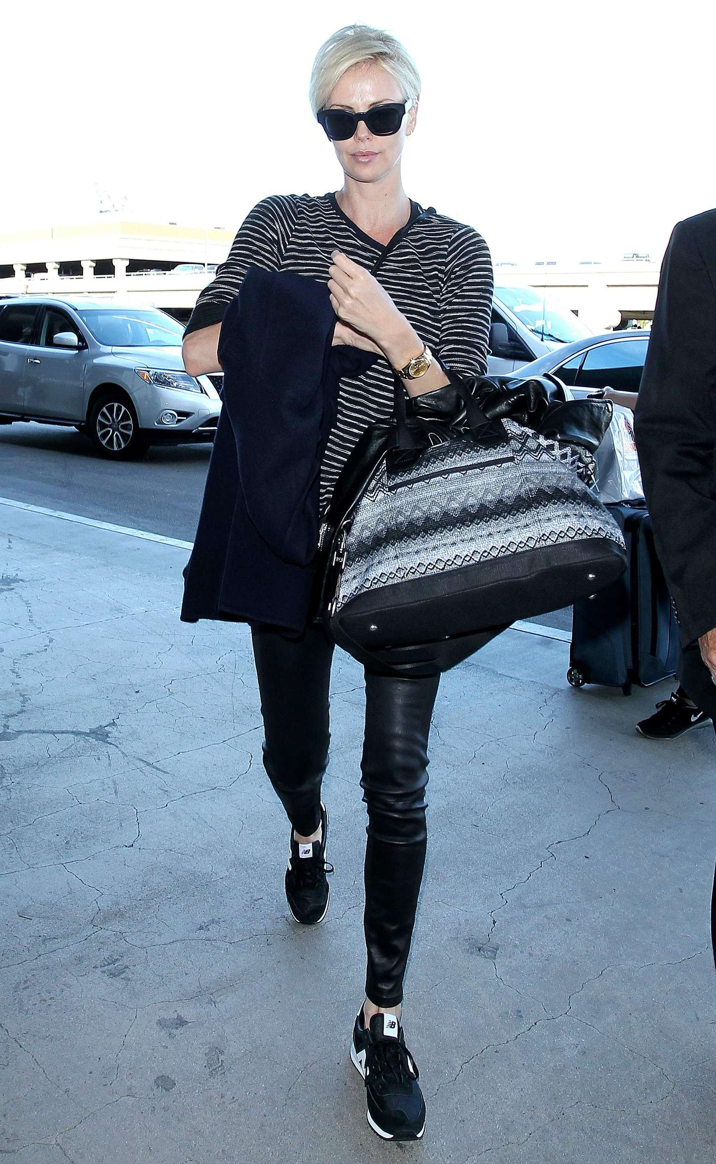 Charlize Theron in Leather at LAX -03 | GotCeleb