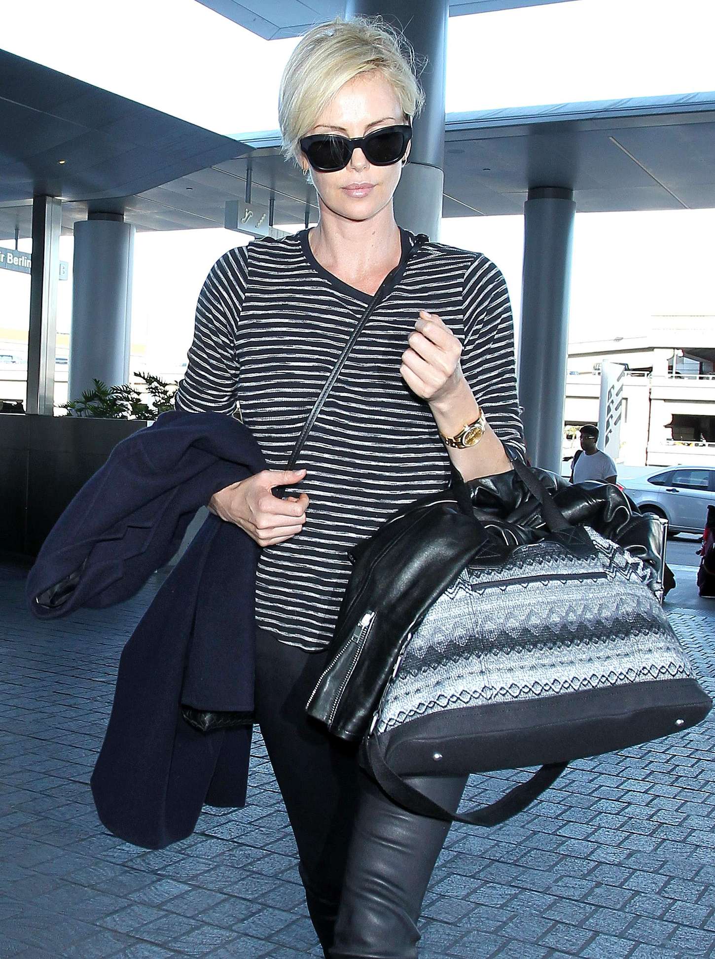 Charlize Theron in Leather at LAX -04 | GotCeleb