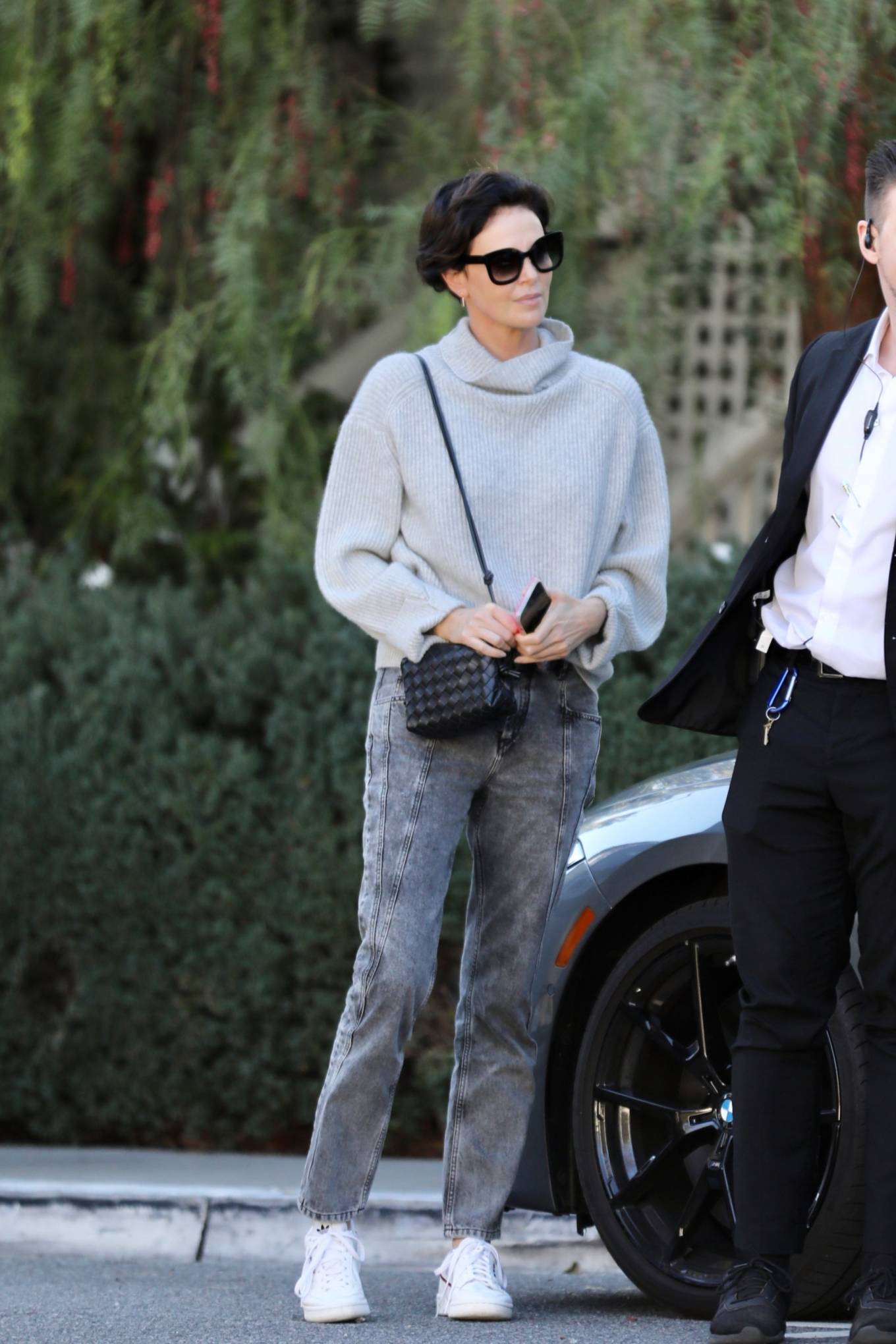 Charlize Theron - In a mock neck knitted sweater as she leaves Bangalô in Los Angeles