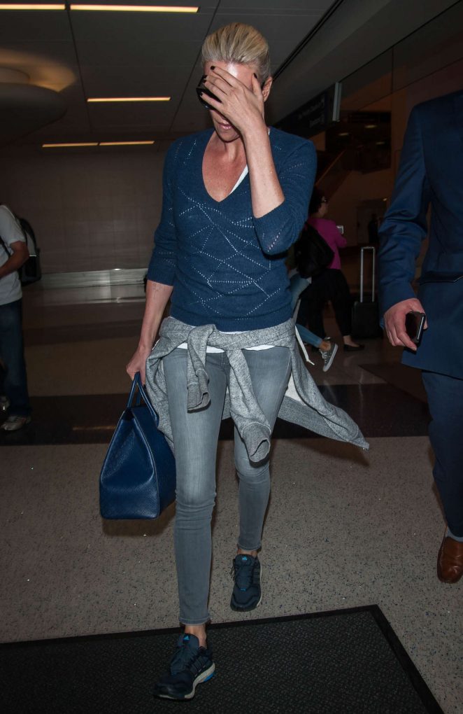Charlize Theron in Jeans at LAX Airport in Los Angeles