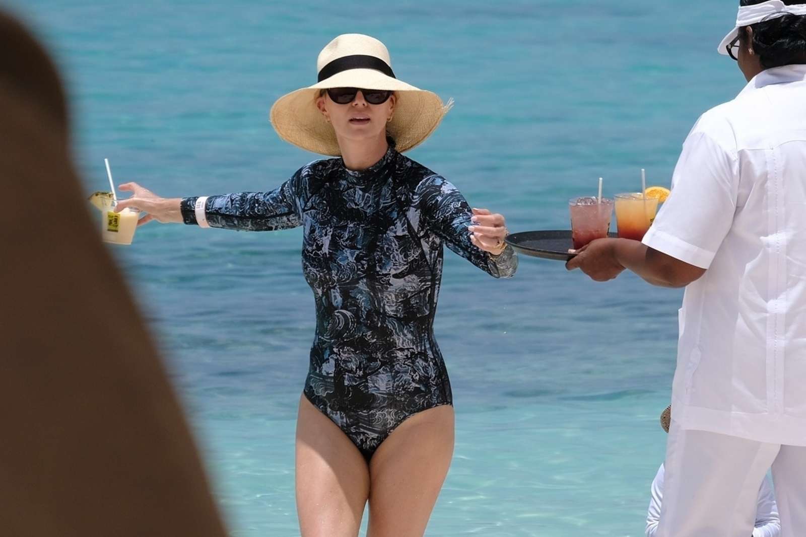 Charlize Theron in Swimsuit at the beach in Bahamas. 