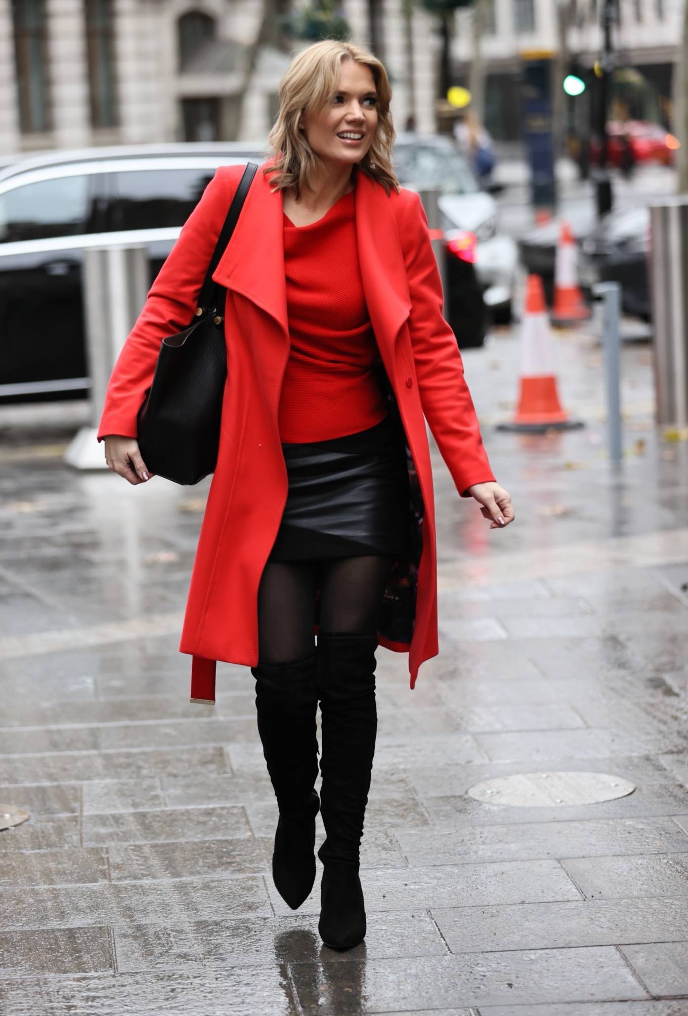 Charlotte Hawkins – In leather mini skirt and high boots in London ...