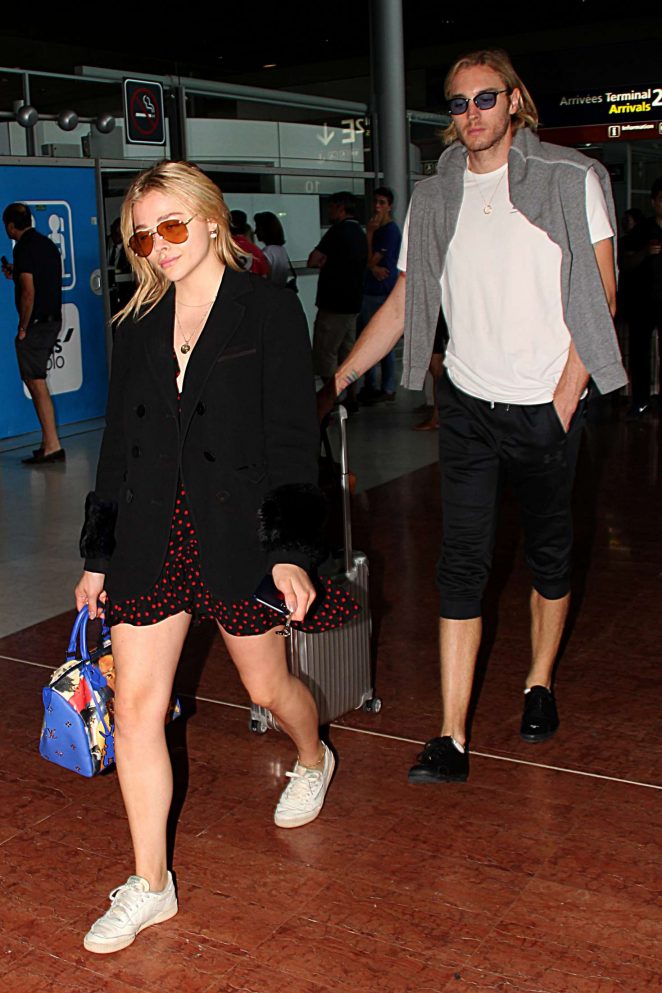 Chloe and Trevor Moretz - Arrive at Charles de Gaulle Airport in Paris