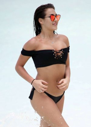 Chloe Goodman in Black Bikini on the beach in Dubai