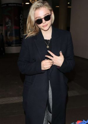 Chloe Moretz in Black Coat at LAX Airport in Los Angeles