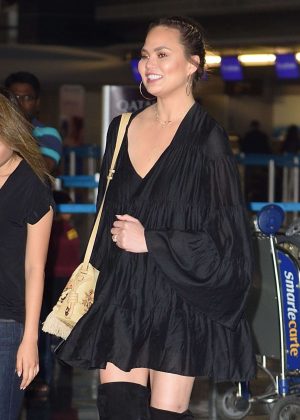 Chrissy Teigen Arrives at JFK airport in NYC