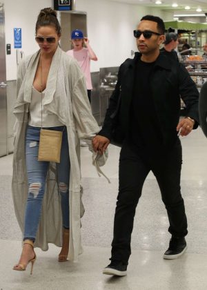 Chrissy Teigen Arriving at Airport in Miami
