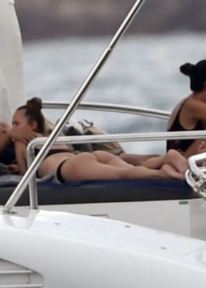 Chrissy Teigen - Bikini Candids on her yacht in Sardinia
