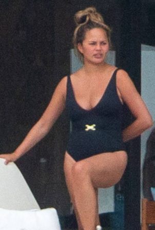 Chrissy Teigen in Black Swimsuit on holiday in Puerto Vallarta