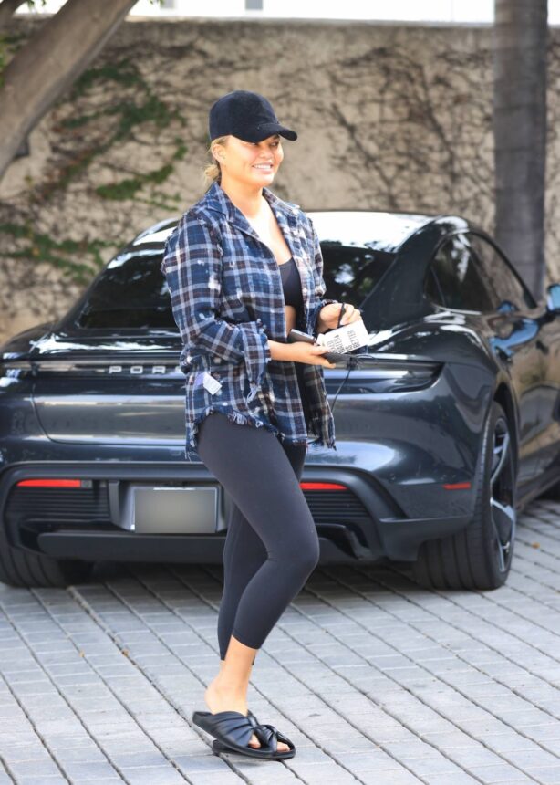 Chrissy Teigen - Wearing her plaid shirt inside out while out in Los Angeles
