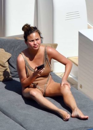 Chrissy Teigen - Wearing Swimsuit on a yacht in Corsica
