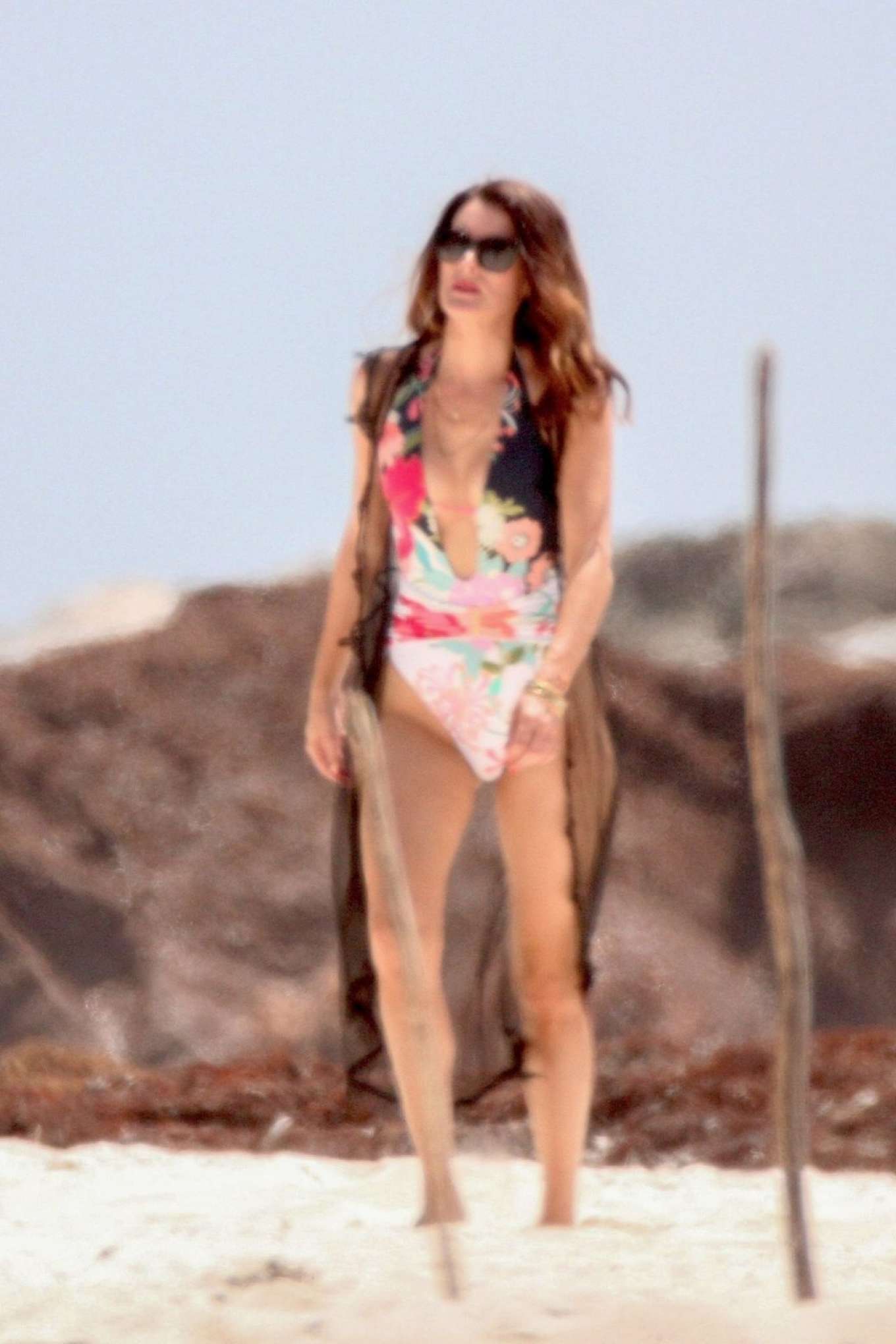 Christina Pascucci in Floral Swimsuit on the beach in Tulum. 