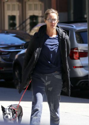 Christy Turlington walking with her french bulldog in Tribeca
