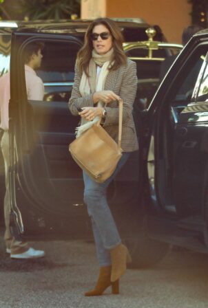 Cindy Crawford - In a tweed coat and blue jeans at the famous Beverly Hills Hotel