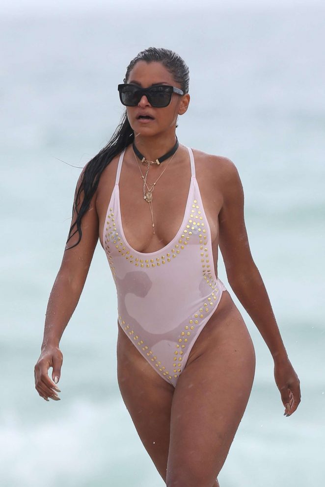 Claudia Jordan in White Swimsuit on the beach in Miami