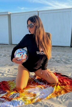 Claudia Romani - On the beach wearing a World Cup sleeve shirt in Miami