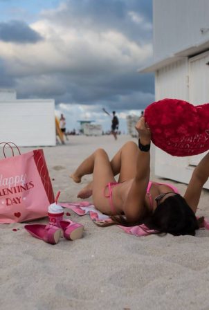 Claudia Romani - Spotted wearing a metallic pink bikini on South Beach