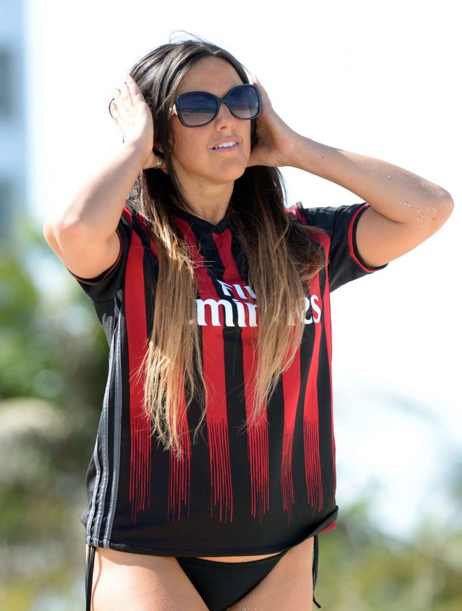 Claudia Romani wearing her AC Milan jersey in Miami
