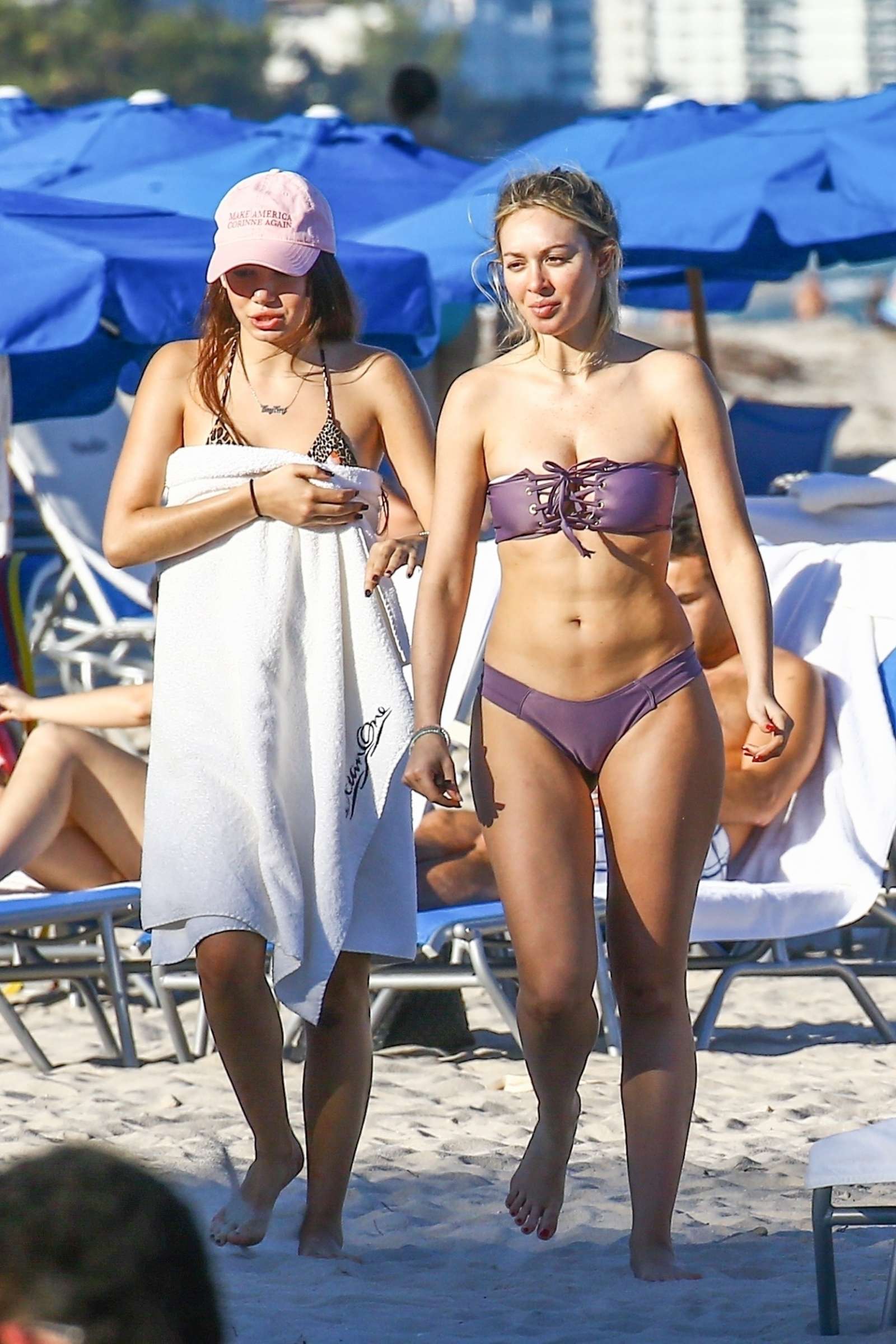 Corinne Olympios in Purple Bikini on the beach in Miami. 