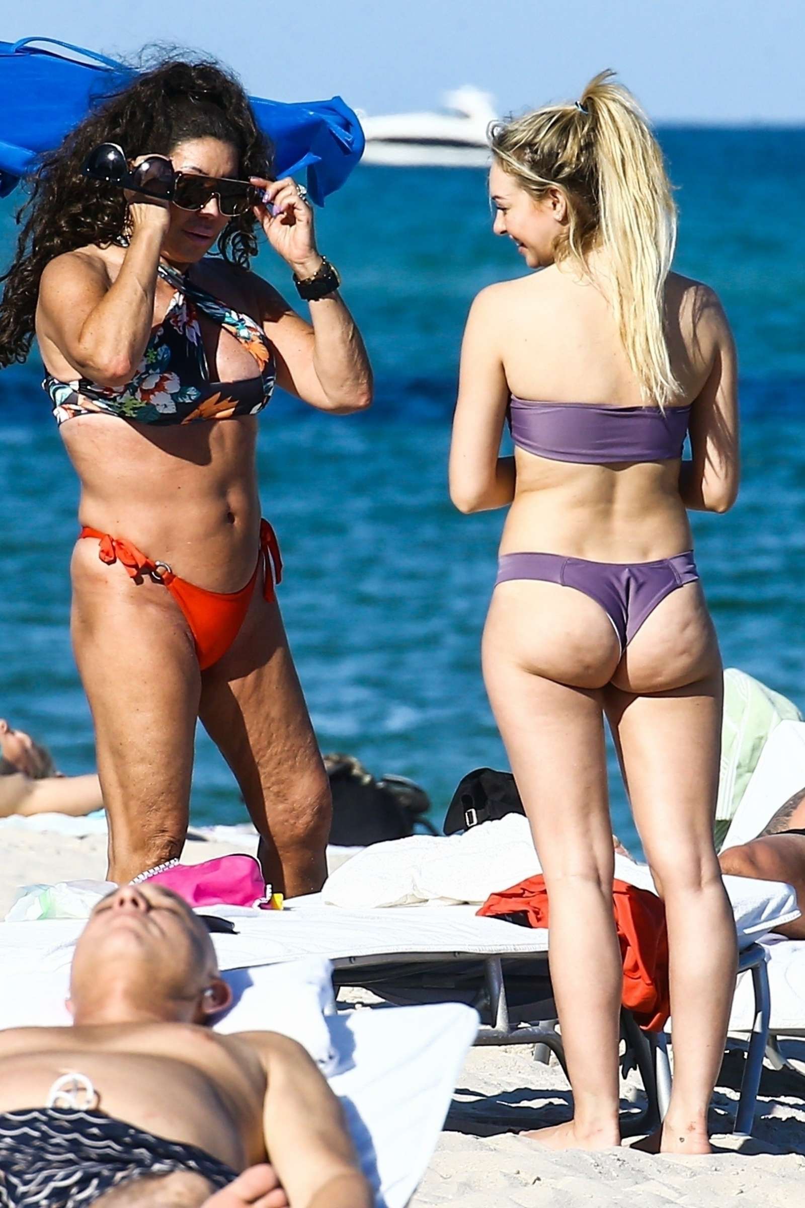 Corinne Olympios in Purple Bikini on the beach in Miami. 