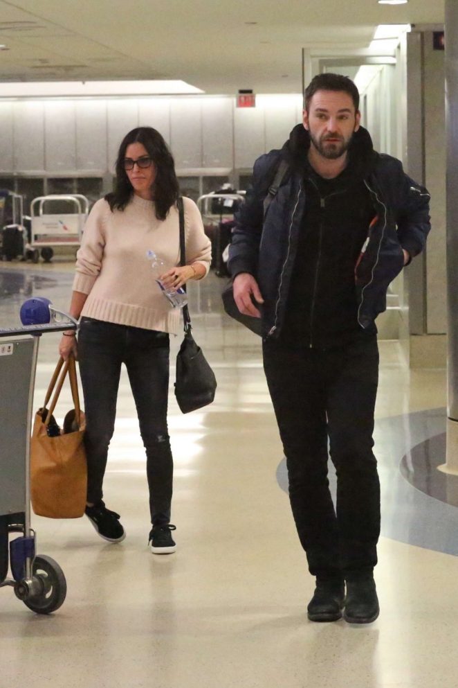 Courteney Cox and fiancee Johnny McDaid at LAX Airport in LA