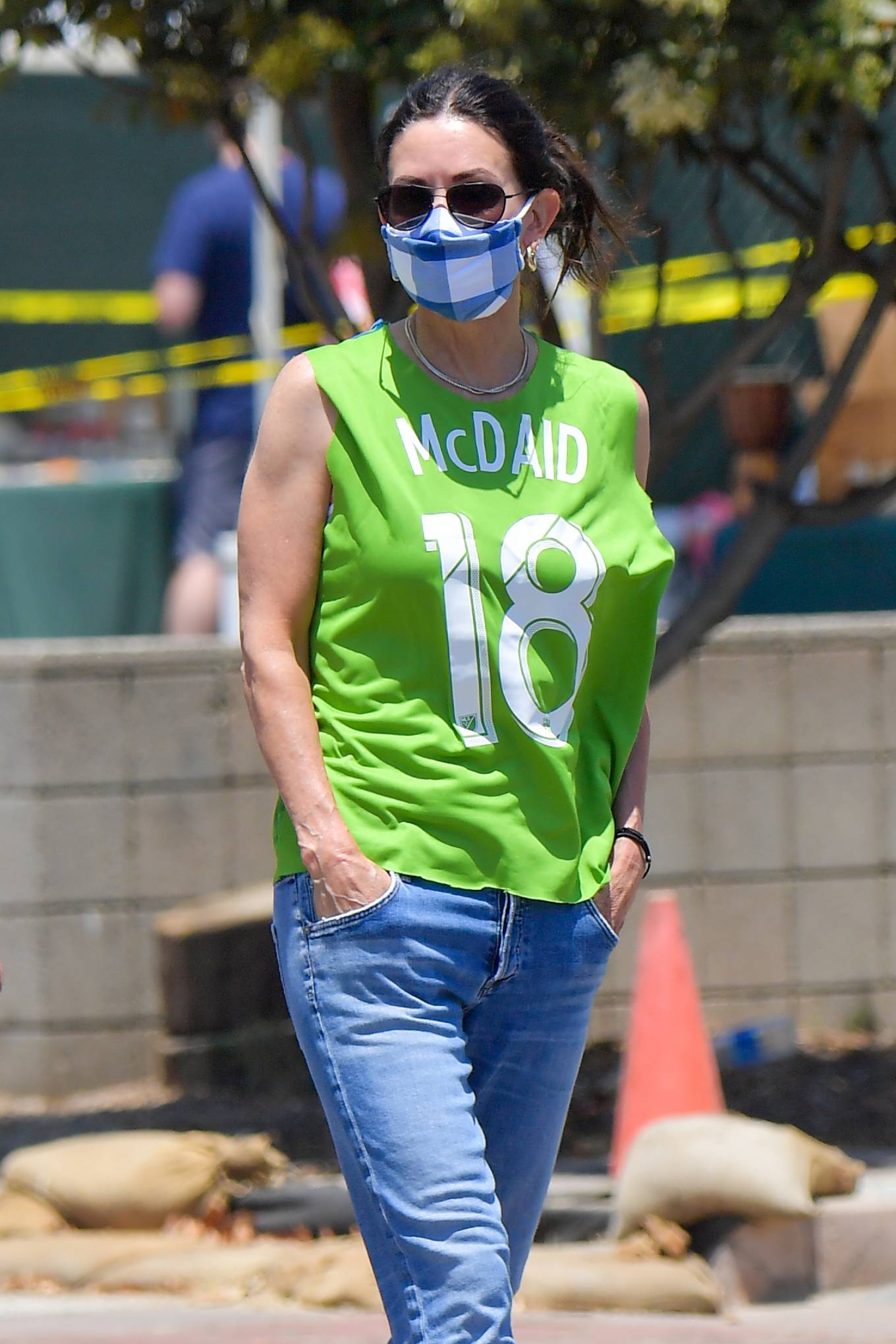 Courteney Cox - Wears a green jersey type shirt in Malibu