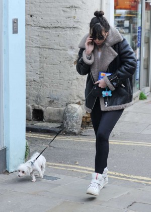 Daisy Lowe walking her dog in Hampstead