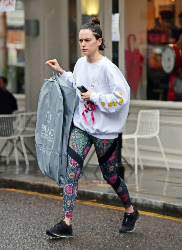Daisy Ridley -  Out in the rain in London
