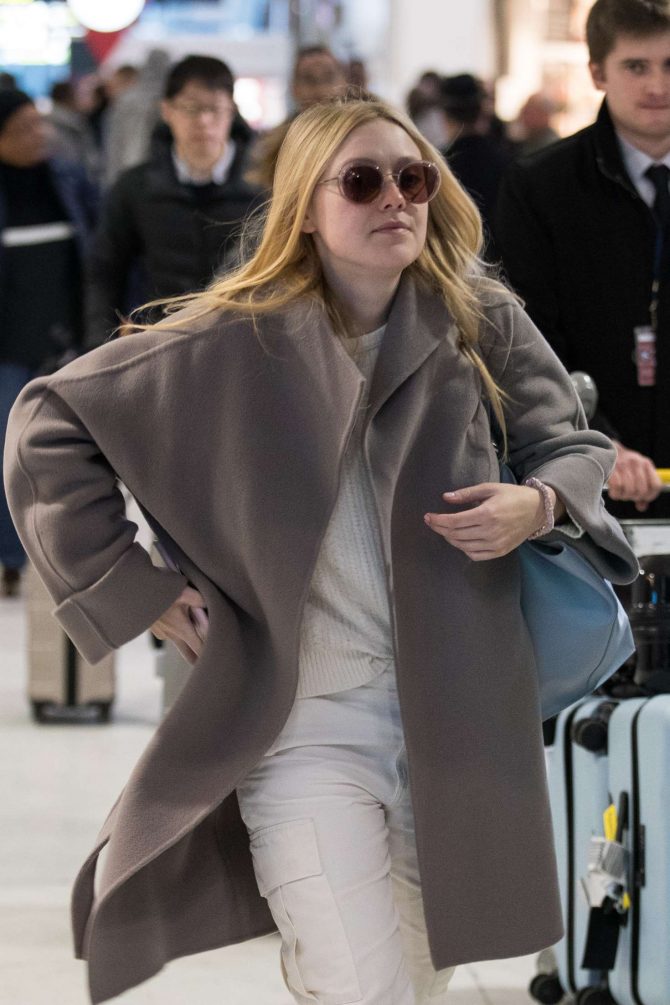 Dakota Fanning - Arrives at Charles de Gaulle Airport in Paris