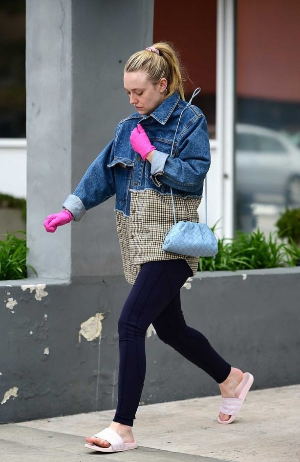 Dakota Fanning - Pink latex Gloves amid Coronavirus outbreak in LA
