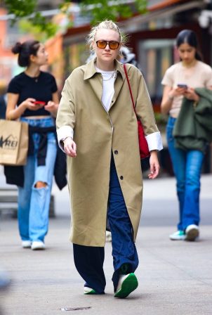 Dakota Fanning - Wearing a trench coat while out in New York