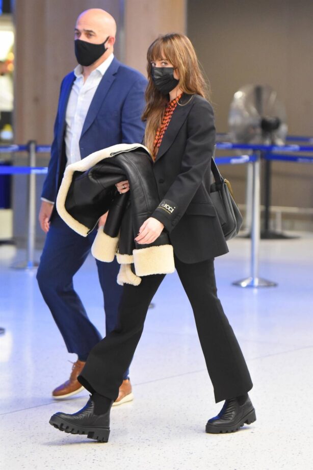 Dakota Johnson - Dressed up in Gucci arriving at JFK Airport in New York