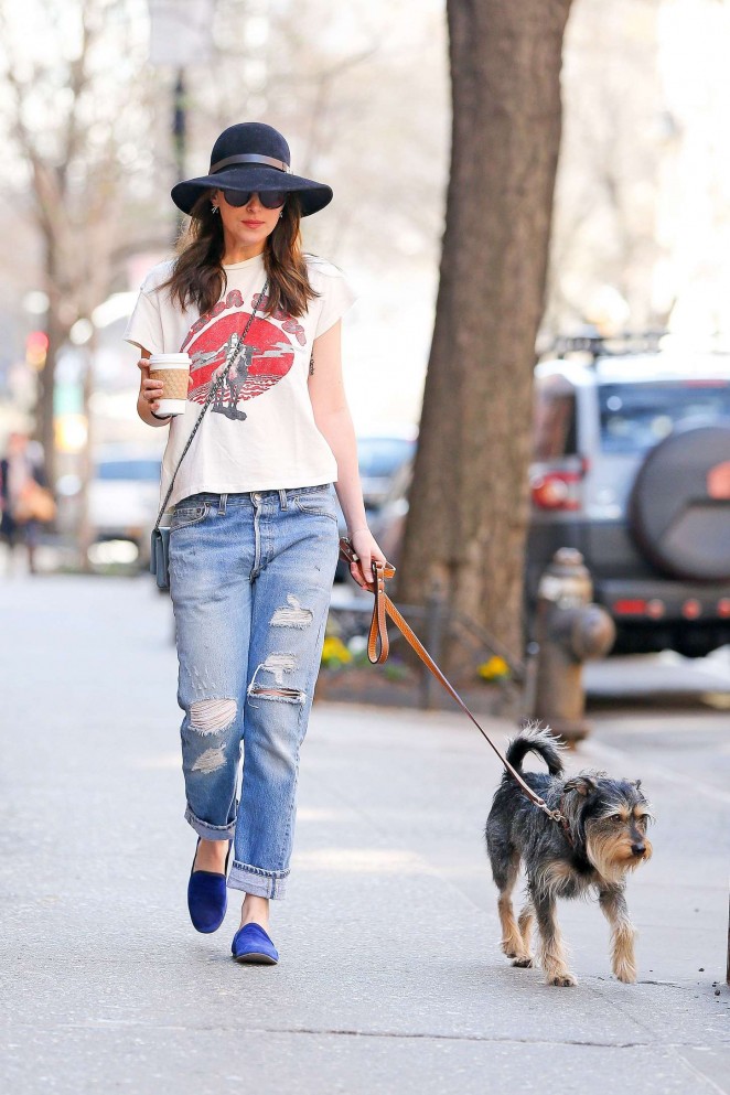 Dakota Johnson in Ripped Jeans Walking her dog in NYC