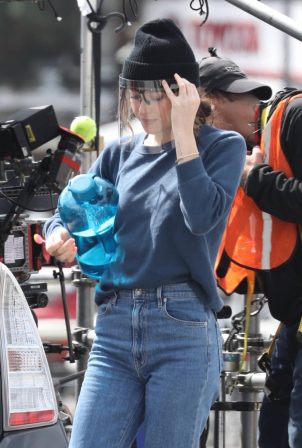 Dakota Johnson - Seen filming her latest project in a grey Prius in Los Angeles