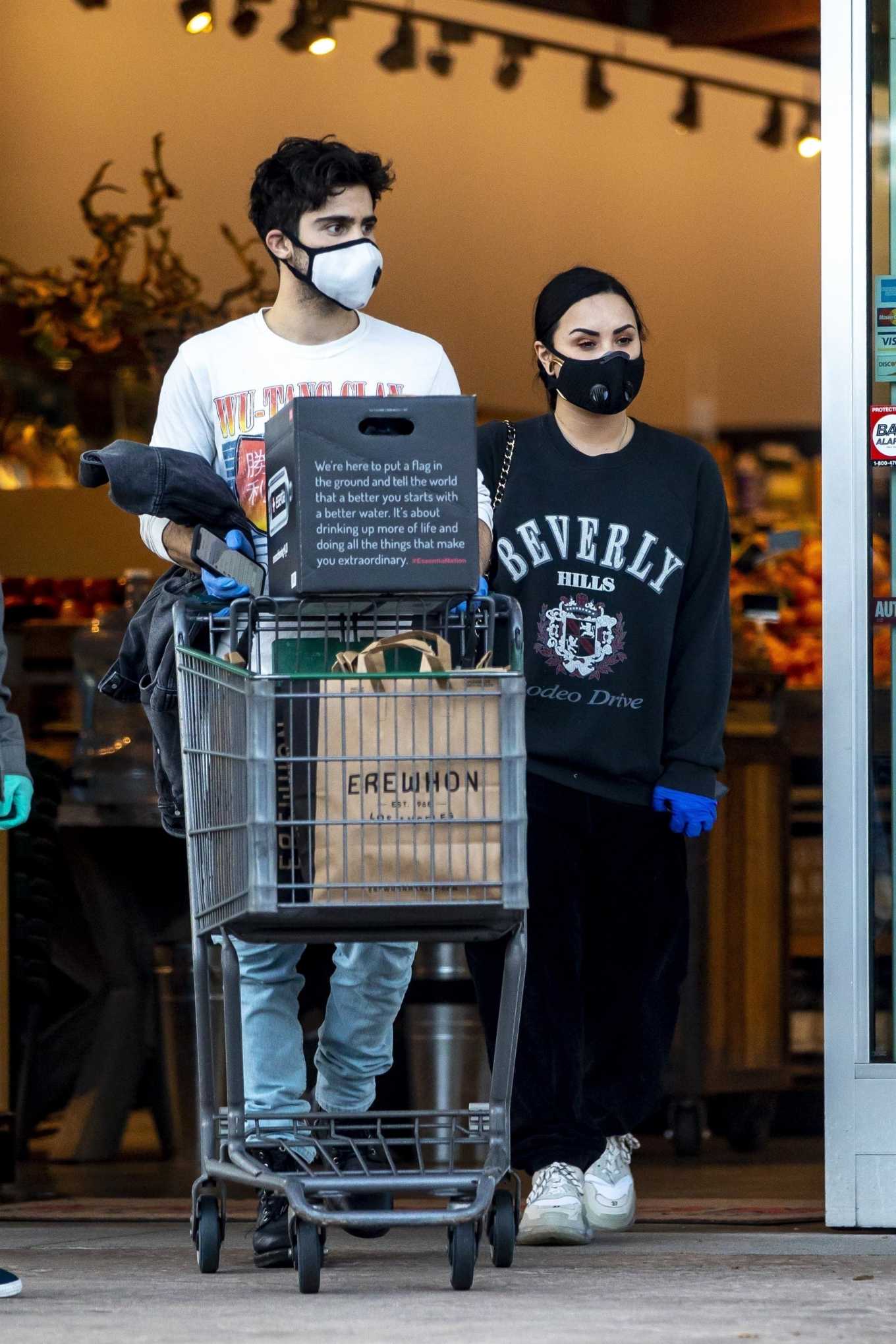 Demi Lovato and Max Ehrich â€“ Shopping at Erewhon Organic store in Los Angeles