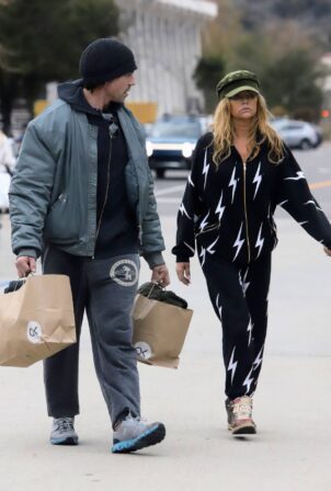 Denise Richards - Shopping in onesie with husband Aaron Phypers in Malibu