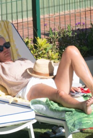 Denise Van Outen - In a bikini at a tennis club pool in Marbella