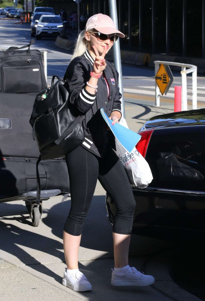 Dove Cameron in Tights Arriving in Vancouver