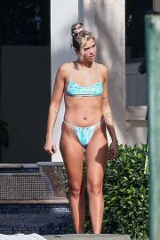Dua Lipa in Blue Bikini on the pool in Miami