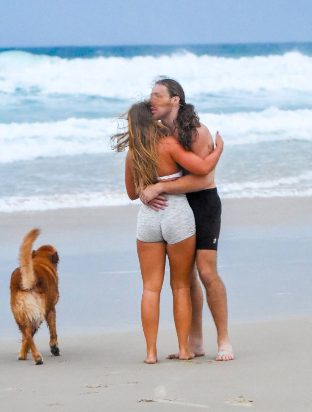 Eden Harper - Seen with their dog along the picturesque Gold Coast beach