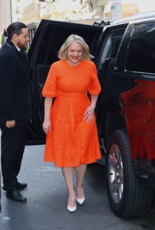 Elisabeth Moss - In a bright orange dress out in New York