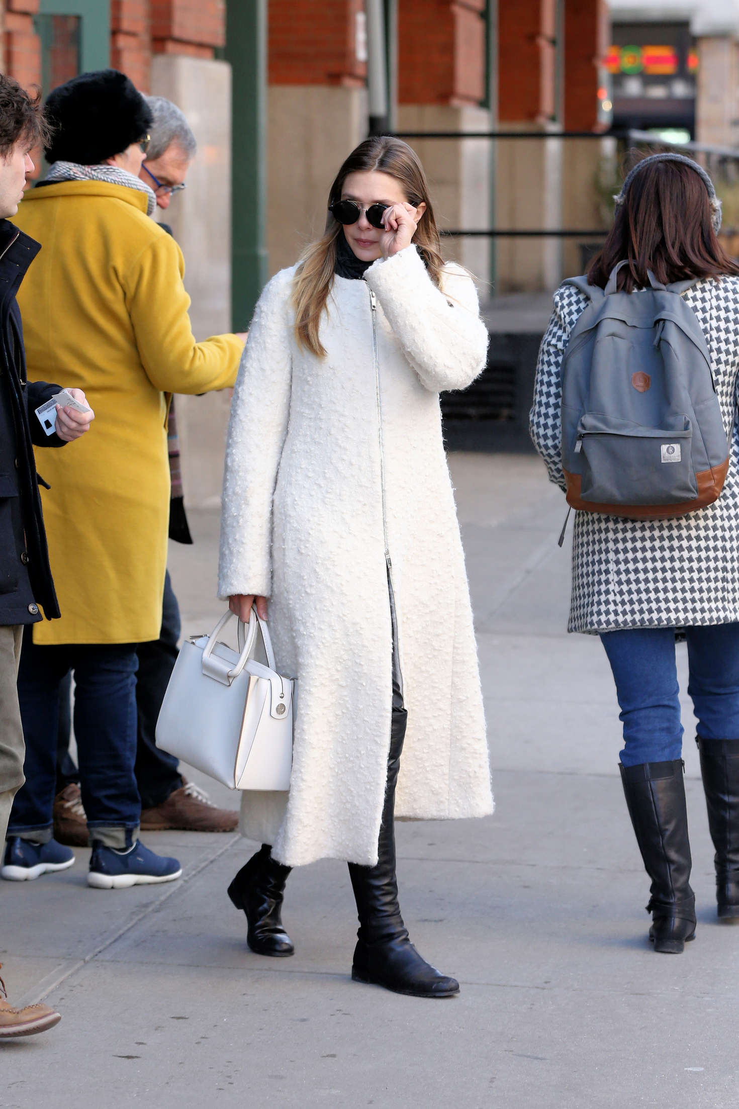 Elizabeth Olsen in White Coat -05 | GotCeleb