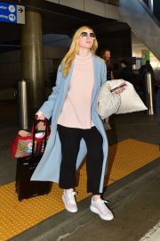 Elle Fanning - Arrives at LAX airport in Los Angeles