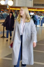 Elle Fanning - Arrives at LAX Airport in Los Angeles