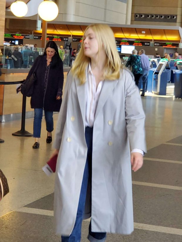Elle Fanning - Arrives at LAX Airport in Los Angeles