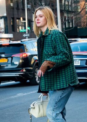 Elle Fanning catches a taxi in NYC