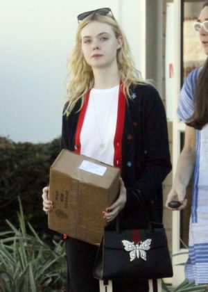 Elle Fanning handling a package in Studio City