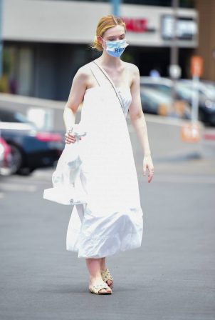 Elle Fanning - In a white maxi dress shopping in Los Angeles